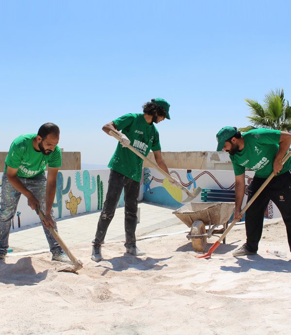 HOMES program volunteers renovating a school